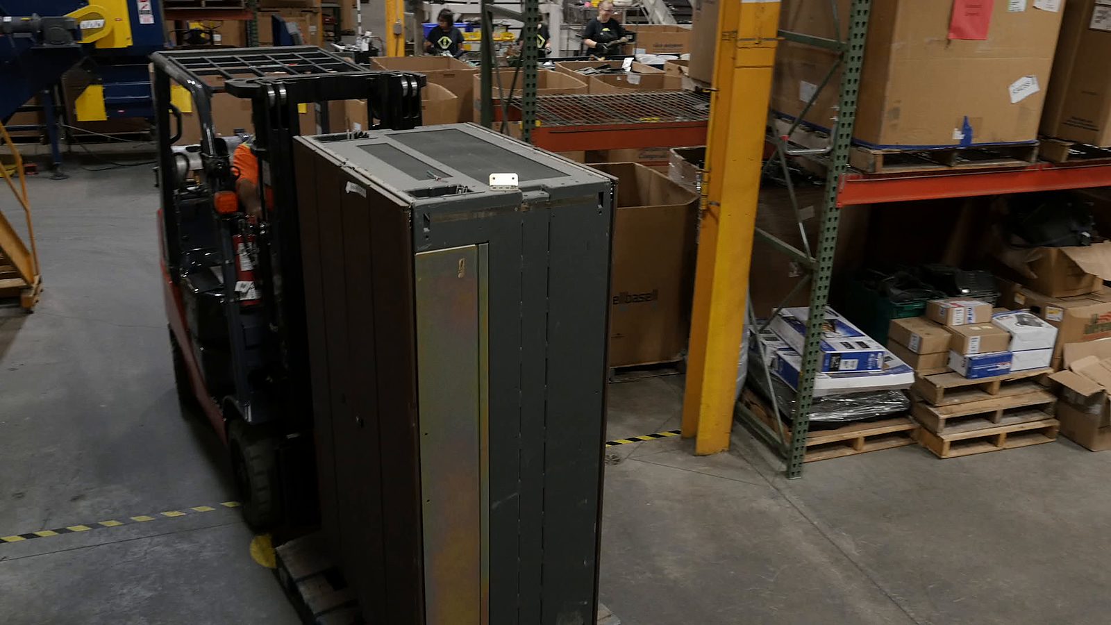 An equipment cabinet carried on a lift truck