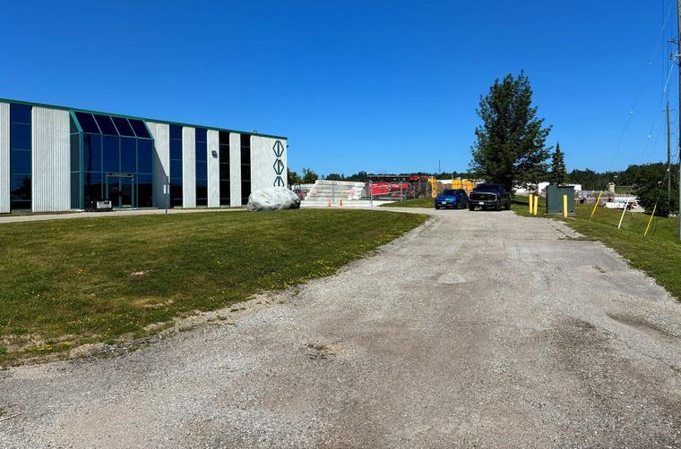 The driveway and yard beside EDI's Orillia facility